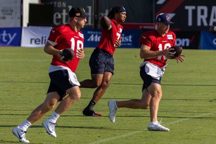 Texans quarterback Case Keenum and quarterback C.J. Stroud and quarterback Davis Mills (10) practice handoffs during training camp at the Houston Methodist Training Center.